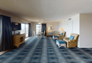 A living room with blue and white checkered carpet.