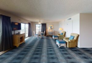 A living room with blue and white carpet