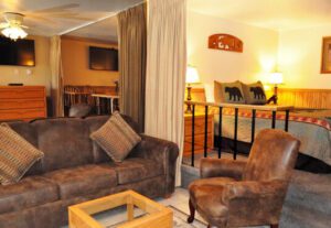 A living room with brown furniture and a table