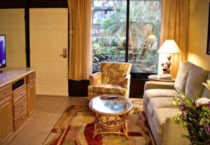 A living room with a couch, chair and table.