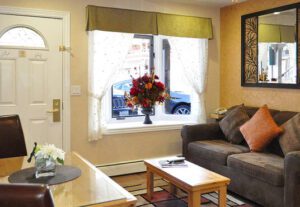 A living room with a couch and table in it