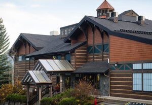 A building with many windows and a roof.