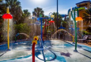 A water park with many different colored fountains.