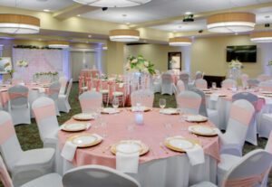 A banquet hall with tables and chairs set up for an event.