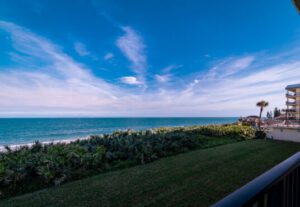 A view of the ocean from a lawn.