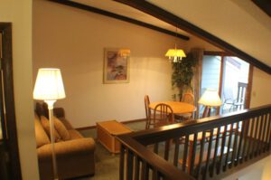 Living room with dining table and lamp.