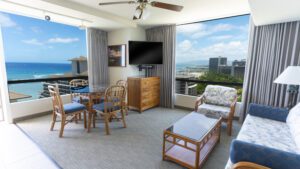 Ocean view living room with furniture.