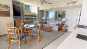 Modern condo with ocean view and dining table.