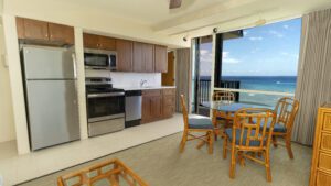 Ocean view condo with kitchen and dining area.