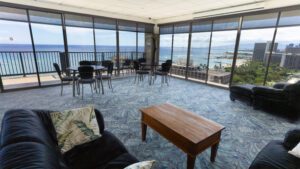 Ocean view living room with furniture.