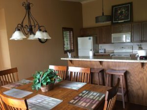 Kitchen dining table with chairs and plant