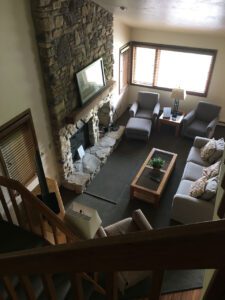 Living room with fireplace and couch.