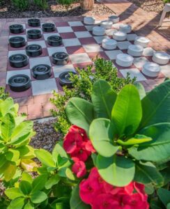 Checkerboard game with red flowers.