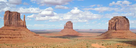 Three sandstone buttes in Monument Valley.