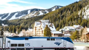 Amtrak train in snowy mountain town.