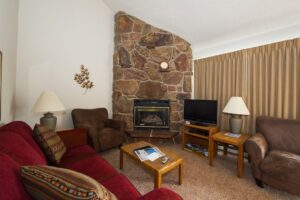 Living room with fireplace and couch.