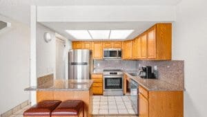 Compact kitchen with breakfast bar stools