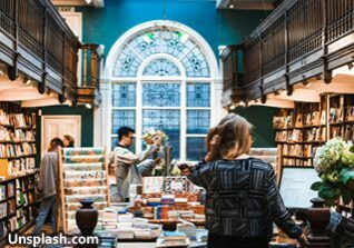 People browse books in a beautiful bookstore.